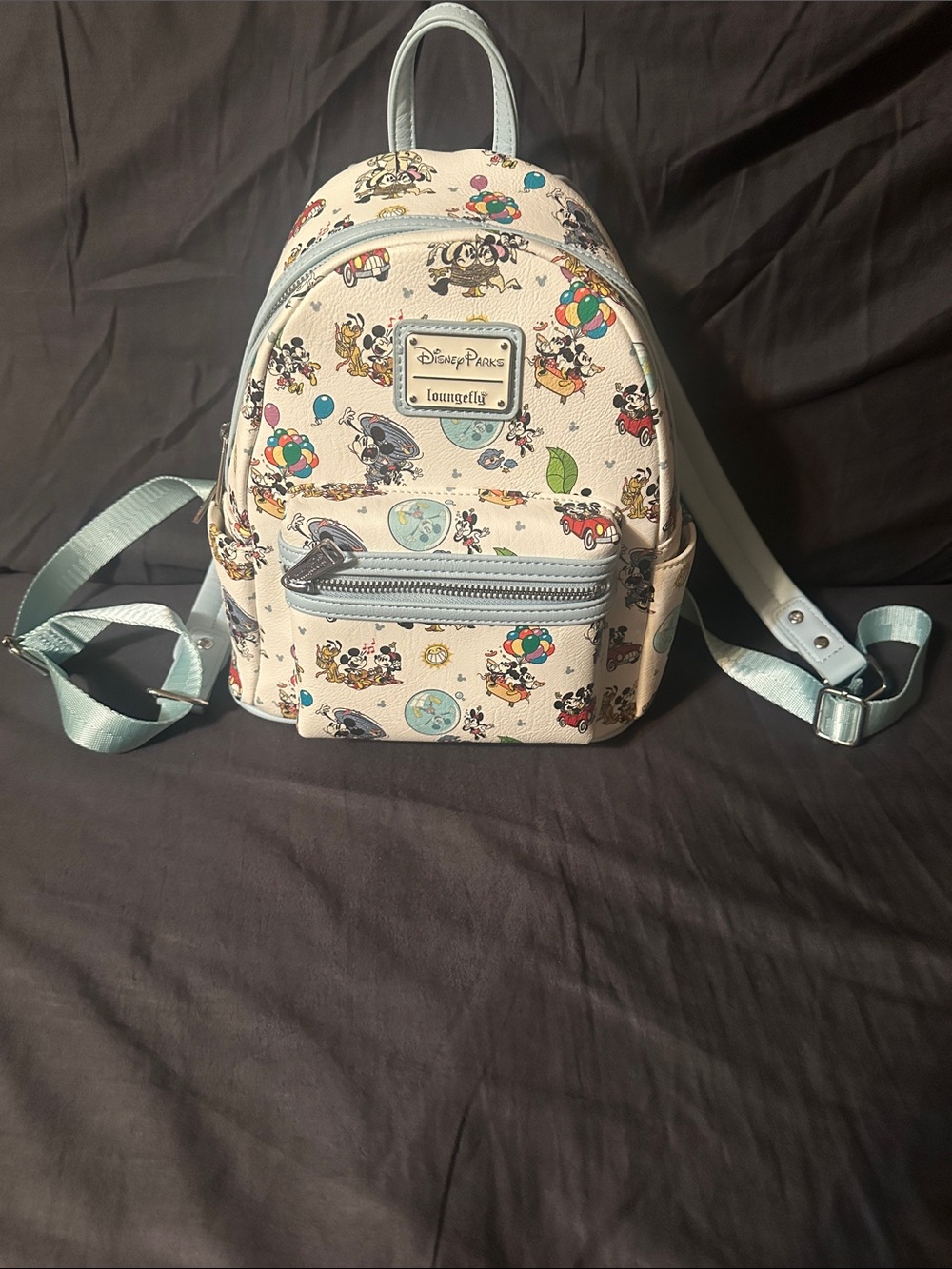 Loungefly Kids Cream Mini Backpack with Light Blue Trim and Disney Print.
